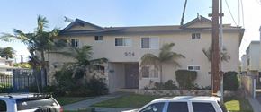 Inglewood apartment for rent - a white house with palm trees in front of it